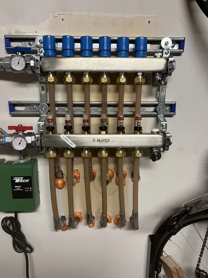 Plumber performing Water Heater Repair at a residential property in Corcoran